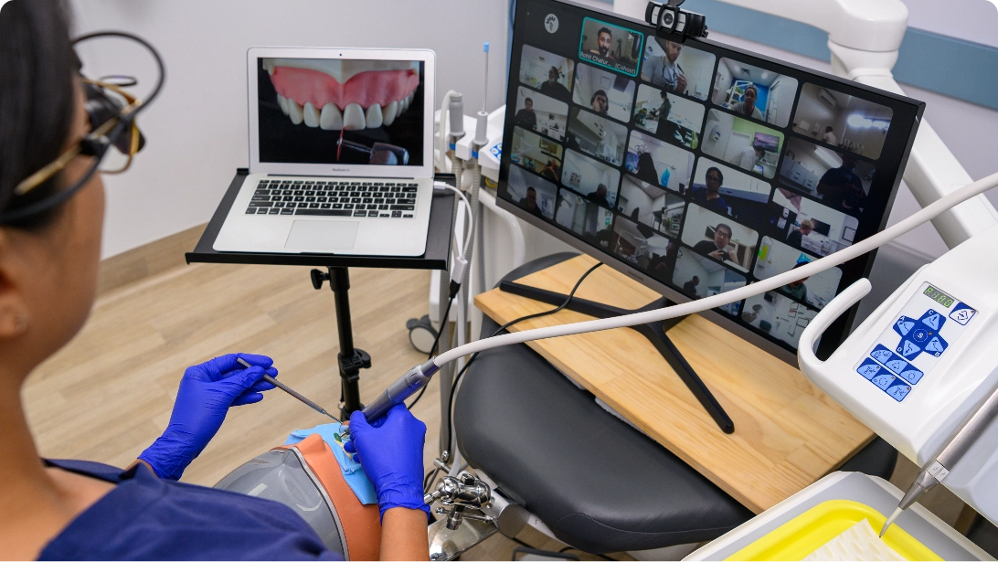 Close of of dentist doing live webinar with tools