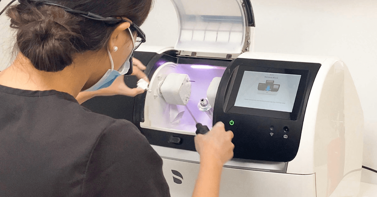 Dentist working on a digital dentistry machine
